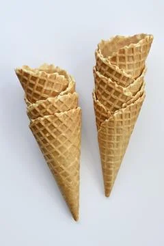 Two empty waffle cones on white background Foto stock