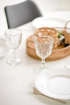 Two Empty Wine Glasses on a Dining Table with a White Tablecloth, Table Stock Photos