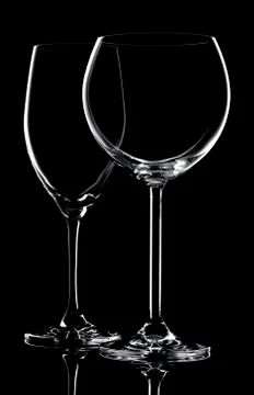 Two empty wine glasses Stock Photos