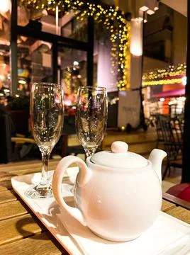 Two empty wine glasses in a restaurant. Stock Photos