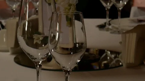 Two empty wine glasses on a wedding table Stock Footage 116799507
