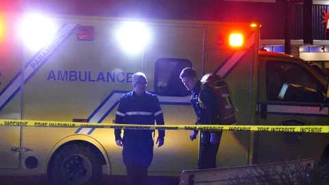 Two EMS debriefing in front of ambulance Stock Footage 103133413