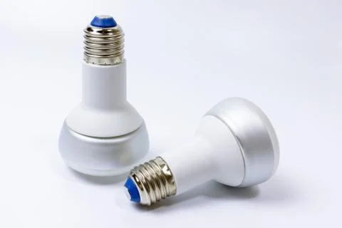 Two energy saving lamp with e27 sockets on white background Stock Photos