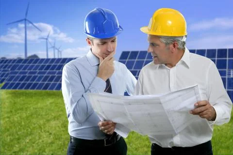 Two engineer architect plan hardhat solar plates Stock Photos