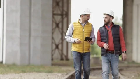 Two Engineer are working at the logistic terminal Stock Footage 111485321