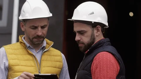 Two Engineer are working at the logistic terminal Stock Footage 111486619