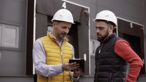 Two Engineer are working at the logistic terminal Stock Footage 111487030