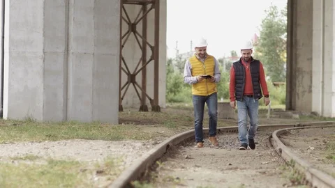 Two Engineer are working at the logistic terminal Stock Footage 111487845