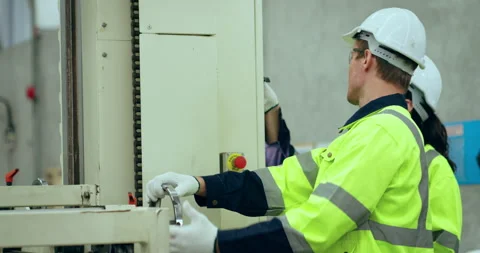 Two Engineer checking machine at factory. Stock Footage 250384797