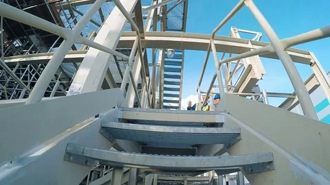 Two engineer discussing a new project with large industry background Stock Footage 71961056