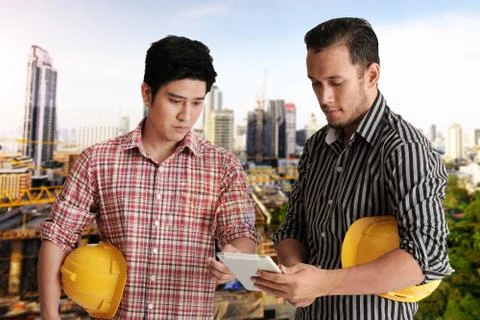 Two engineer discussing project Stock Photos
