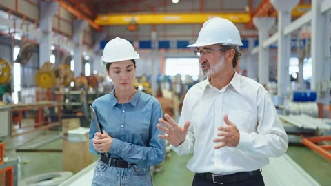 Two engineer man and woman manager leader walking in factory talking for work 스톡 동영상 237008161
