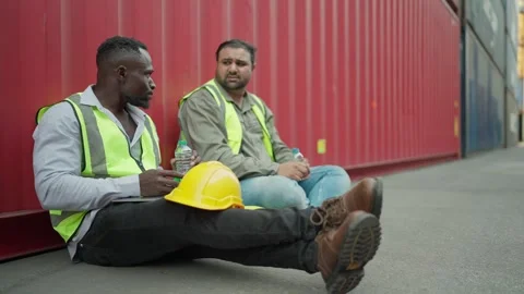 Two engineer man worker drinking water on bottle and resting after working hard. Stock Footage 266777990