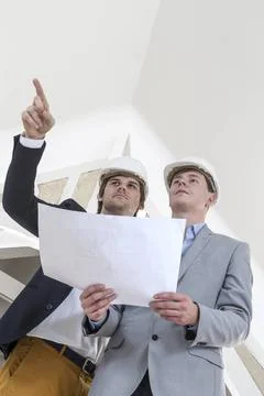 Two engineer or architect discuss on project at renovation construction Tw... Stock Photos