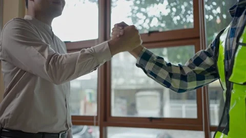 Two engineer or architect handshaking after a project done at office. Stock Footage 232469645