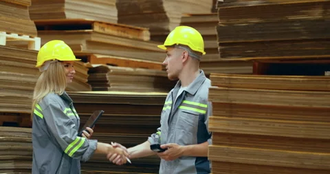 Two engineer talking in warehouse together. Stock Footage 249988812