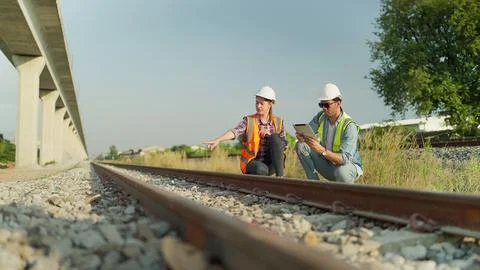 Two engineer using tablet discussion and inspection construction process railway Stock Photos