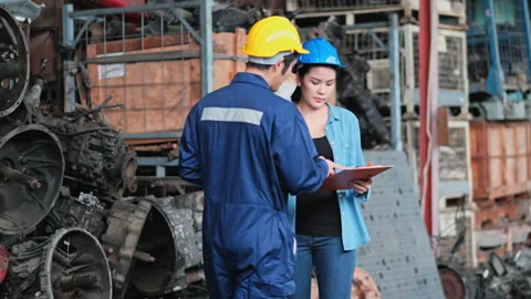 Two engineer walk in the factory and discuss on work Stock Footage 142523606
