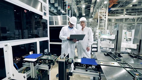 Two engineering experts are observing co... | Stock Video | Pond5