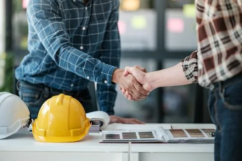 Two engineering man with construction worker greeting a foreman at renovating Stock Photos