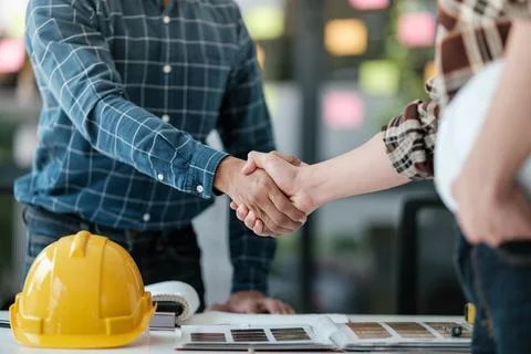 Two engineering man with construction worker greeting a foreman at renovating Stock Photos