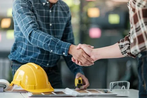 Two engineering man with construction worker greeting a foreman at renovating Stock Photos