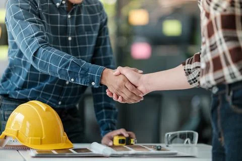 Two engineering man with construction worker greeting a foreman at renovating Stock Photos