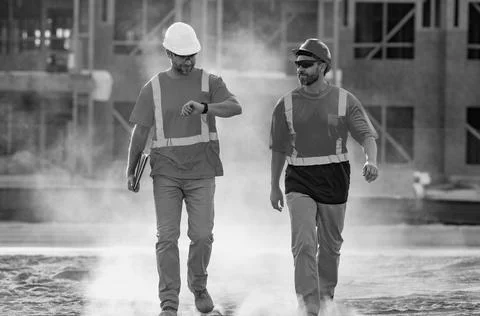 Two engineers. Architect at a construction site. Handyman builders in hardhat Stock Photos