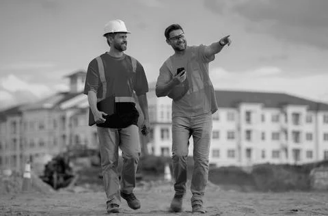 Two engineers. Architect at a construction site. Handyman builders in hardhat Stock Photos