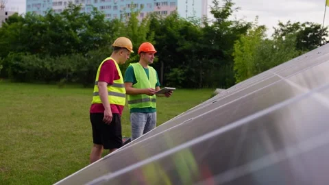 Two engineers are discussing the efficiency of renewable green energy Video stock 316232219