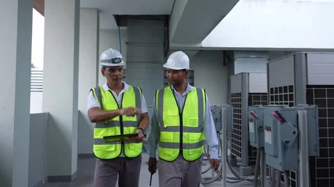 Two Engineers are discussing work in a construction building. Stock Footage 280732465