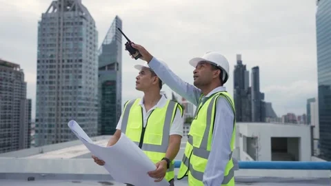 Two Engineers are discussing work in a construction building. 動画素材 280732531