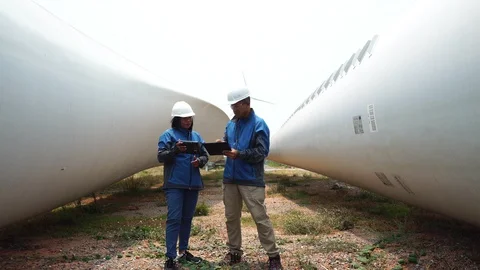 Two engineers are talking about wind turbine system  Stock Footage 127918680
