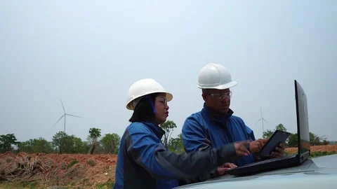 Two engineers are talking about wind turbine system  Stockbeeldmateriaal 127922314