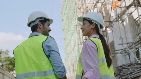 Two engineers are wearing white helmet ready safety and walking Stock Footage 146888225