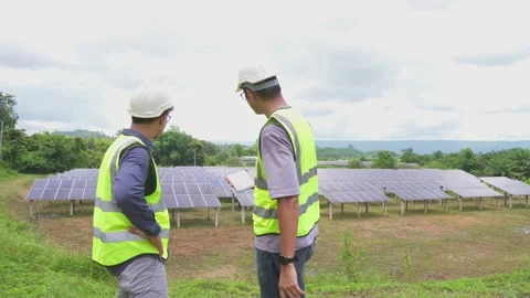 Two engineers are working to install solar panels. Stock Footage 210818270