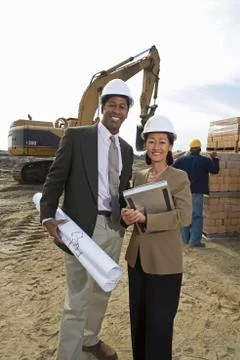 Two Engineers With Blueprint At Site Stock Photos