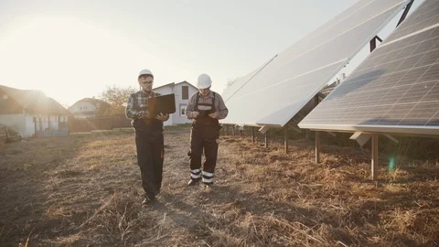Two engineers checking construction of alternative solar batteries Video stock 103956765