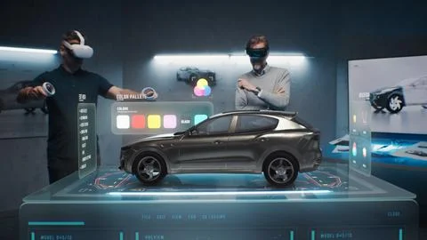 Two engineers choose a color for a prototype of a future car Stock Photos