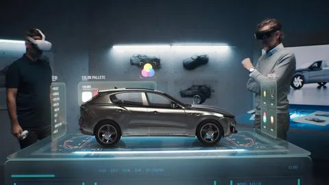Two engineers choose a color for a prototype of a future car Stock Photos