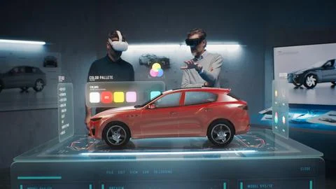 Two engineers choose a color for a prototype of a future car Stock Photos