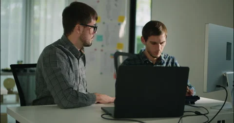 Two Engineers Collaborating on Robotics Software Project. Stock Footage 306737710