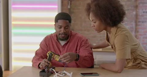 Two Engineers Developing Robot Technology in Workshop Video stock 241828676