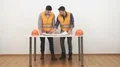 The two engineers discuss drawing on the white wall background 4k or 4k+ Resolution