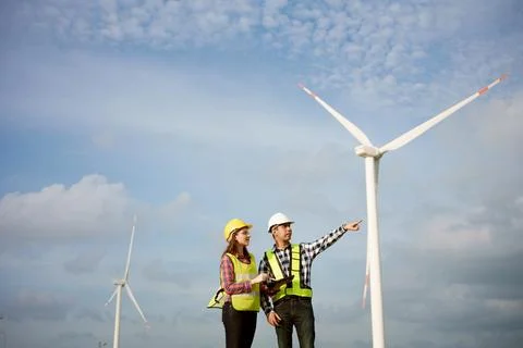 Two engineers discussed the plan for the maintenance of wind turbines.  Stock-Fotos