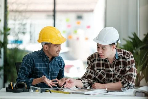 Two engineers discussion and planning about project. Brainstorming of engineers Stock Photos