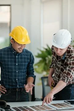 Two engineers discussion and planning about project. Brainstorming of engineers Stock Photos