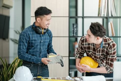 Two engineers discussion and planning about project. Brainstorming of engineers Stock Photos