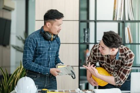 Two engineers discussion and planning about project. Brainstorming of engineers Stock Photos