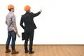 The two engineers gesture on the white wall background Photo